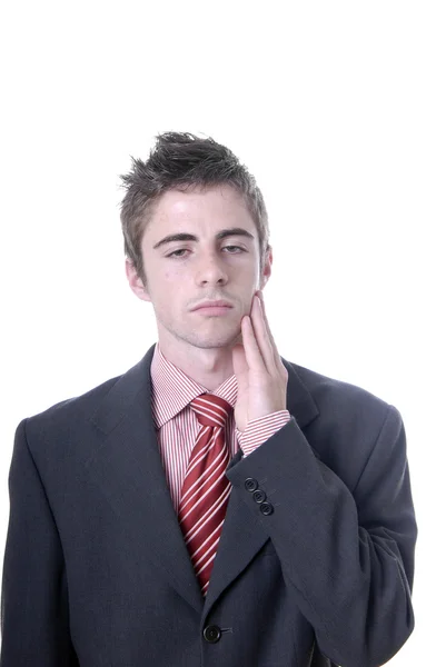 Businessman in a suit gestures with a headache — Stock Photo, Image
