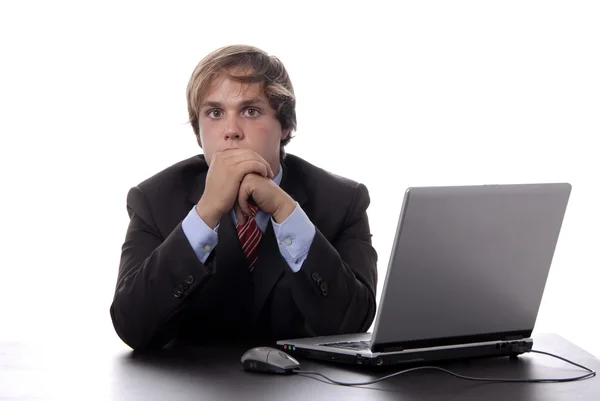 Young man wondering and working with is laptop — Stock Photo, Image