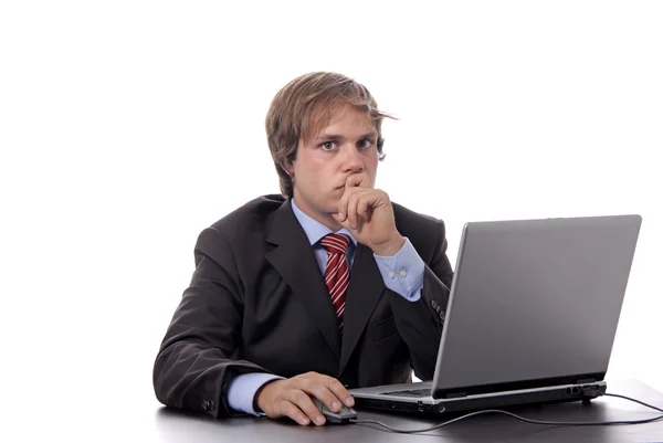 Young man wondering and working with is laptop — Stock Photo, Image