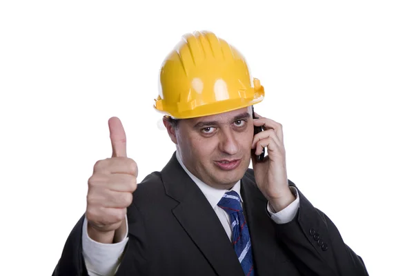 Mérnök, a telefon a sárga kalapban — Stock Fotó