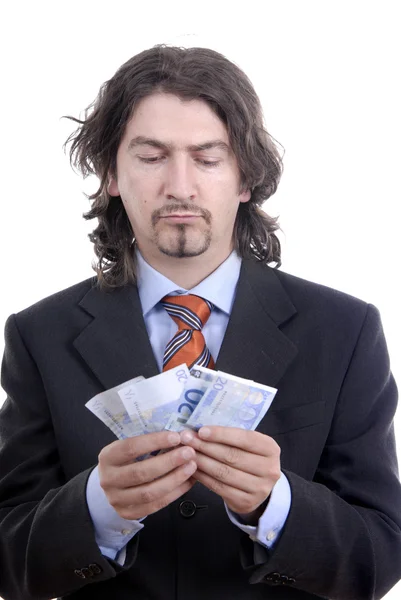 Obchodní muž drží peníze, izolované na bílém — Stock fotografie