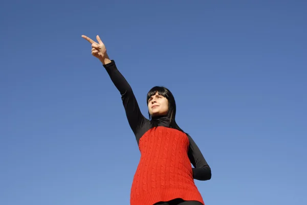 Young casual woman with the sky as background — Stock Photo, Image