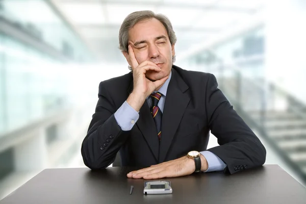 Mature business man on a desk — Stock Photo, Image