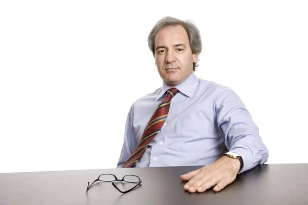 Mature business man on a desk — Stock Photo, Image