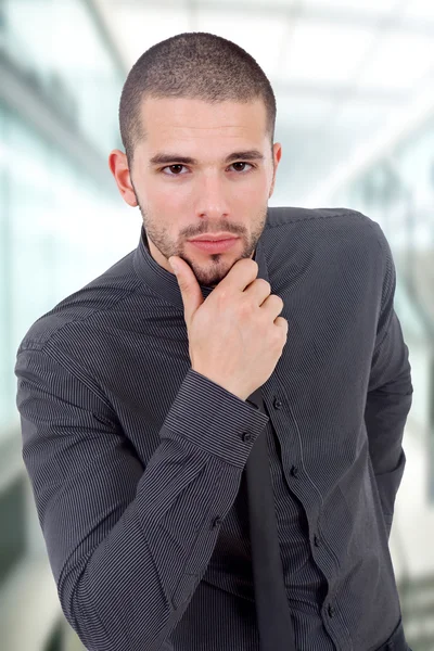 Pensive young business man portrait at the office — Stock Photo, Image