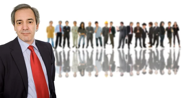 Business man in front of a group of — Stock Photo, Image