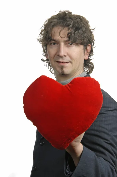 Hombre sosteniendo un corazón rojo en la mano — Foto de Stock