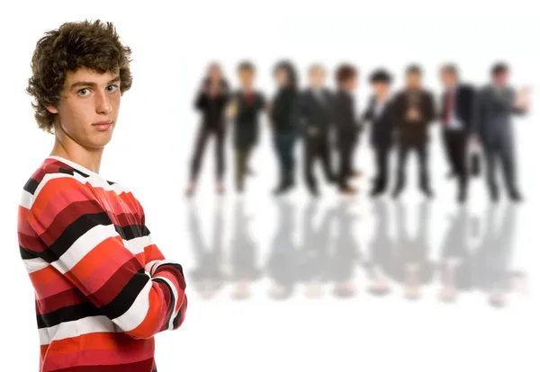 A young man in front of a group of — Stock Photo, Image