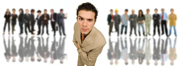 An young man in front of a group of , isolated — Stock Photo, Image