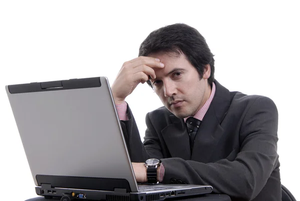 Young bored man and working with laptop Royalty Free Stock Images