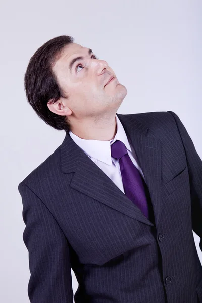 Young business man looking up — Stock Photo, Image