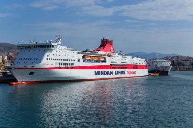 Pireas Greece: Ferry boats cruise ships docking at the port of Piraeus Greece. The port of Piraeus is the largest passenger port in Europe and the third largest in the world.