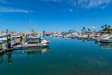 VILA REAL DE SANTO ANTONIO, PORTUGAL - Yachts and boats moored in the marina with waterfront buildings along the Avenida da Republica to the rear, Vila Real de Santo Antonio, Algarve, Portugal