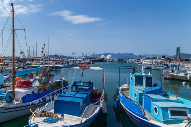 Greece, Athens. Moored pleasure yachts and fishing boats in the Port of Piraeus. Warm sunny day by the sea in Greece. 