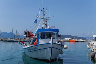 Greece, Athens. Moored pleasure yachts and fishing boats in the Port of Piraeus. Warm sunny day by the sea in Greece. 