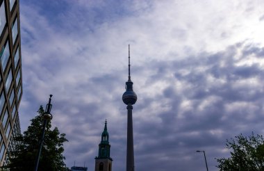 Berlin, Germany - Soaring shaft and silver sphere of Fernsehturm TV tower in Berlin.