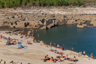 Geres, Portugal: People at the old ruins of Vilarinho das Furnas, located in Campo de Geres, Terras de Bouro, on margins of River Homem