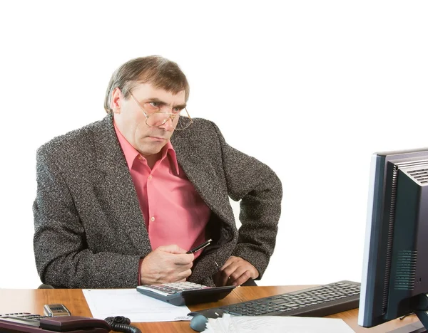 A business man in an office works at the computer — Stock Photo, Image