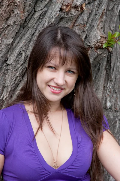 Beautiful woman on nature in a park — Stock Photo, Image