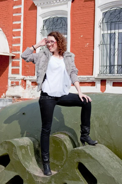 Woman in a museum of military equipment — Stock Photo, Image