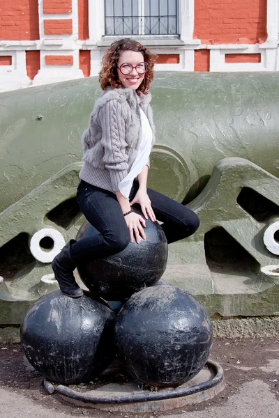 Woman in a museum of military equipment — Stock Photo, Image