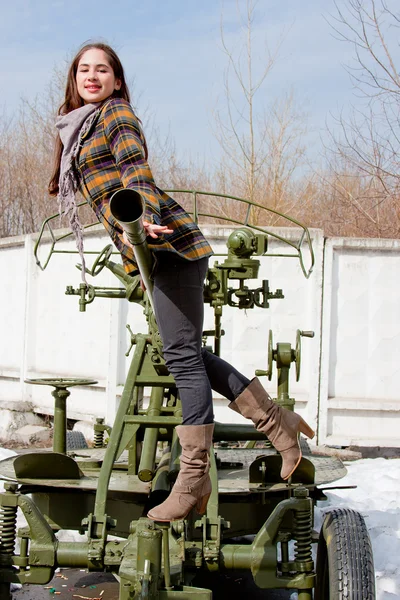 Woman in a museum of military equipment — Stock Photo, Image