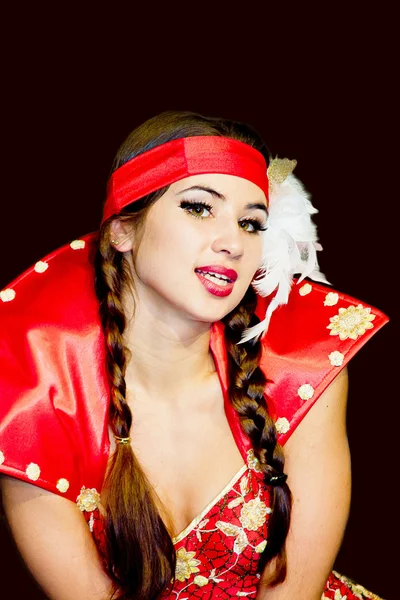 Young woman in a beautiful dress on a black background — Stock Photo, Image