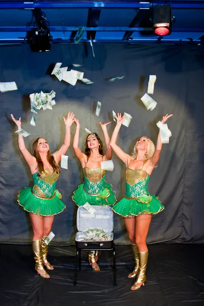Three young beautiful women with the suitcase of money — Stock Photo, Image