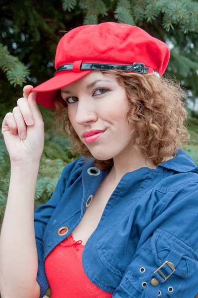 Young woman in a cap of red — Stock Photo, Image