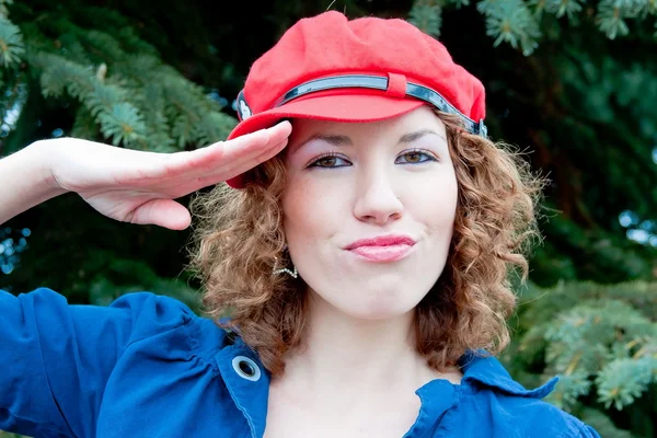 Young woman in a cap of red — Stock Photo, Image