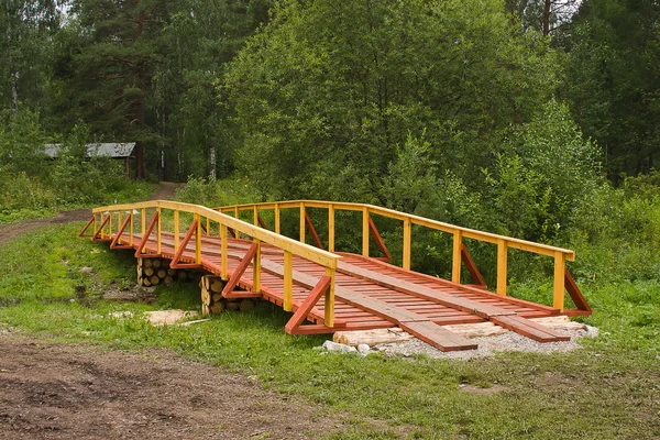 New wooden bridge in field — Stock Photo, Image