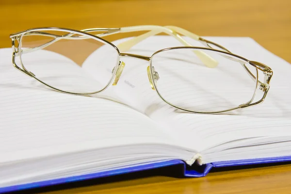 Notebook and glasses — Stock Photo, Image
