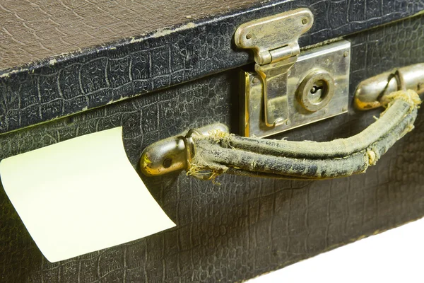 Fragment of ancient black suitcase and sticky papers — Stock Photo, Image