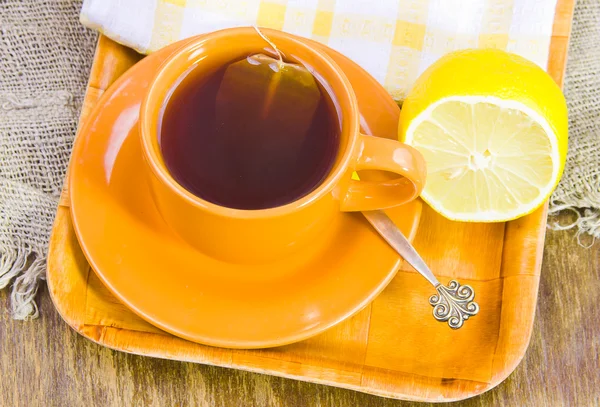 Cup with tea and lemon — Stock Photo, Image