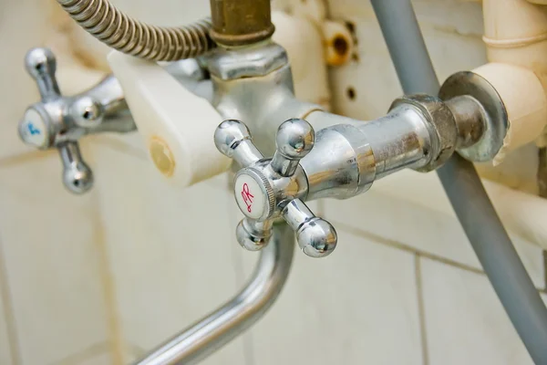 Old faucets in a bathroom — Stock Photo, Image