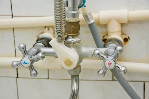 Old faucets in a bathroom — Stock Photo, Image