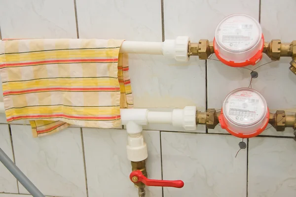 Meters on pipes in a bathroom — Stock Photo, Image