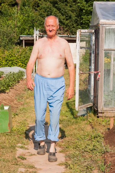 Elderly man on a suburban — Stock Photo, Image