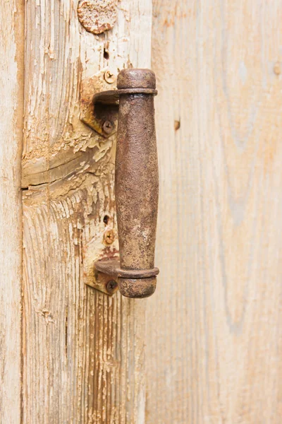 Pen on an old wooden door — Stock Photo, Image