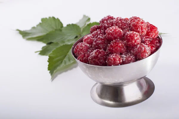 Raspberries in cup — Stock Photo, Image