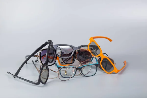 Heap Different Glasses Reading Sunglassesclose Grey Background — Stock Photo, Image