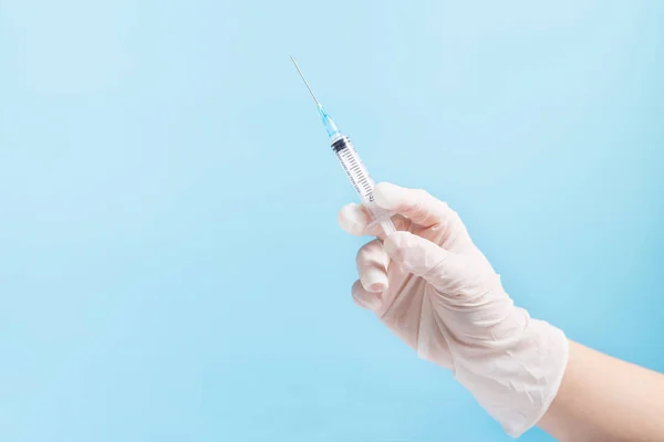 Hand White Gloves Holding Syringe Dos Eof Vaccine Close Blue Royalty Free Stock Images