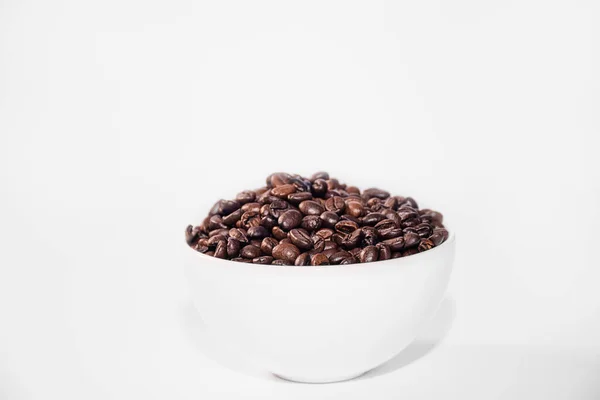 Whole Grain Natural Black Coffee White Bowl White Background lizenzfreie Stockbilder