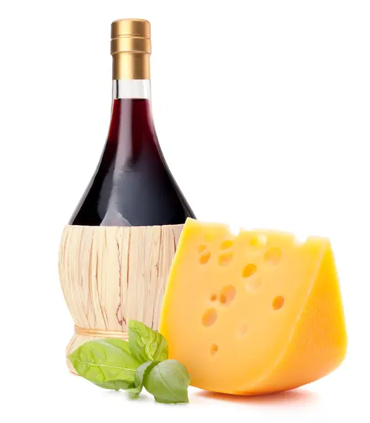 Red wine bottle, cheese and basil leave still life — Stock Photo, Image