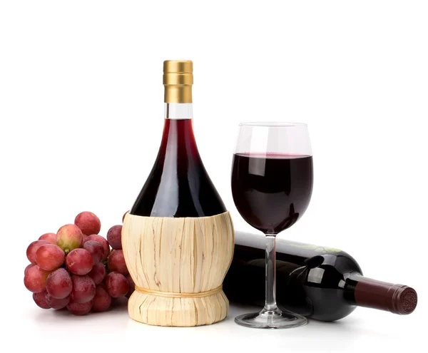 Full red wine glass goblet, bottle and grapes — Stock Photo, Image