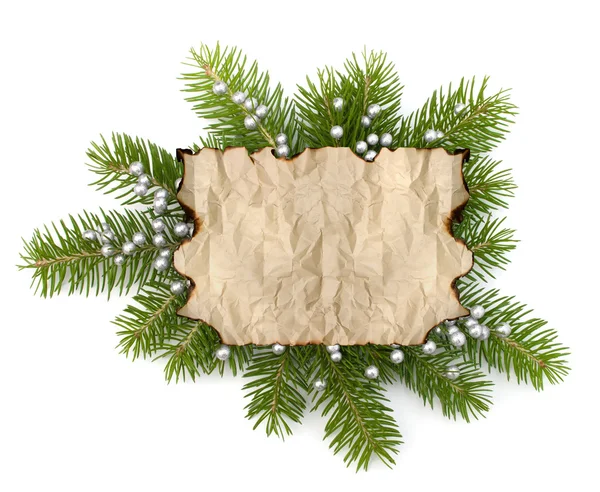 Old parchment paper with copy space on Christmas tree branch bac — Stock Photo, Image