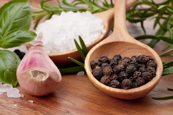 Fresh herbs and salt spoon — Stock Photo, Image