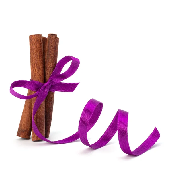 Festive wrapped cinnamon sticks — Stock Photo, Image