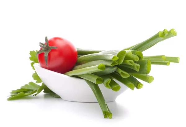 Spring onions and cherry tomato in bowl — Stock Photo, Image