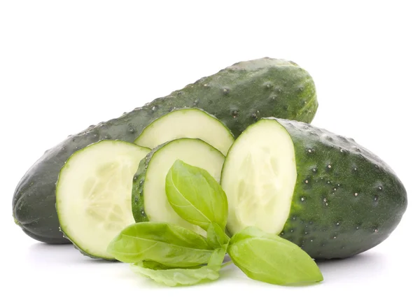 Sliced cucumber vegetable and basil leaves still life — Stock Photo, Image